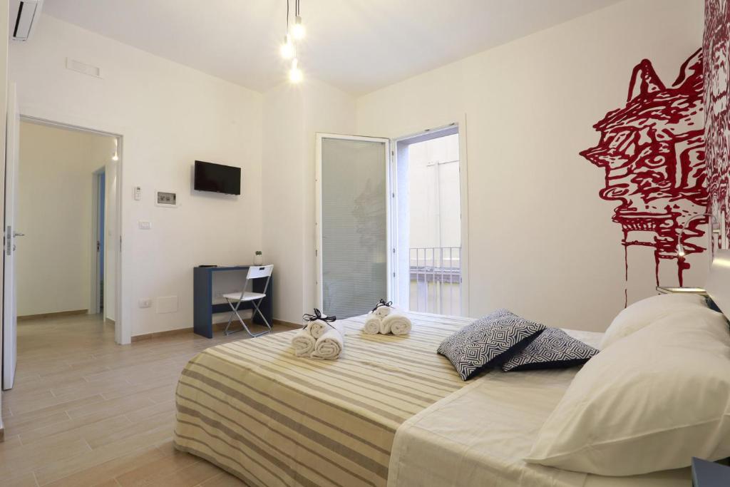 Postel nebo postele na pokoji v ubytování B&B EVO Nardò