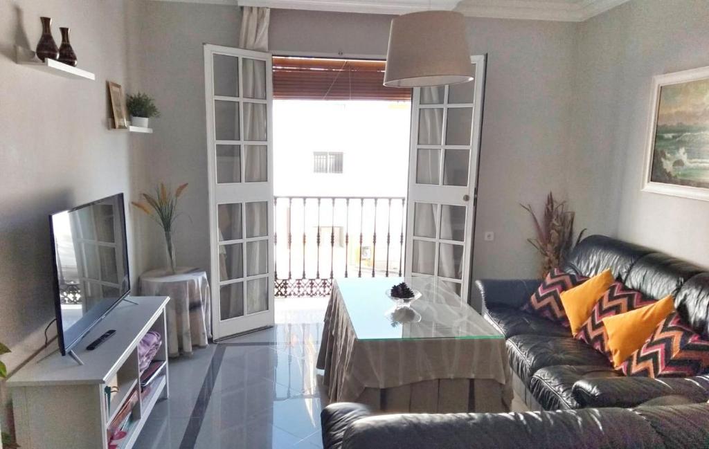a living room with a couch and a table at Casa Clara, Caminito de Rey in Valle de Abdalagís