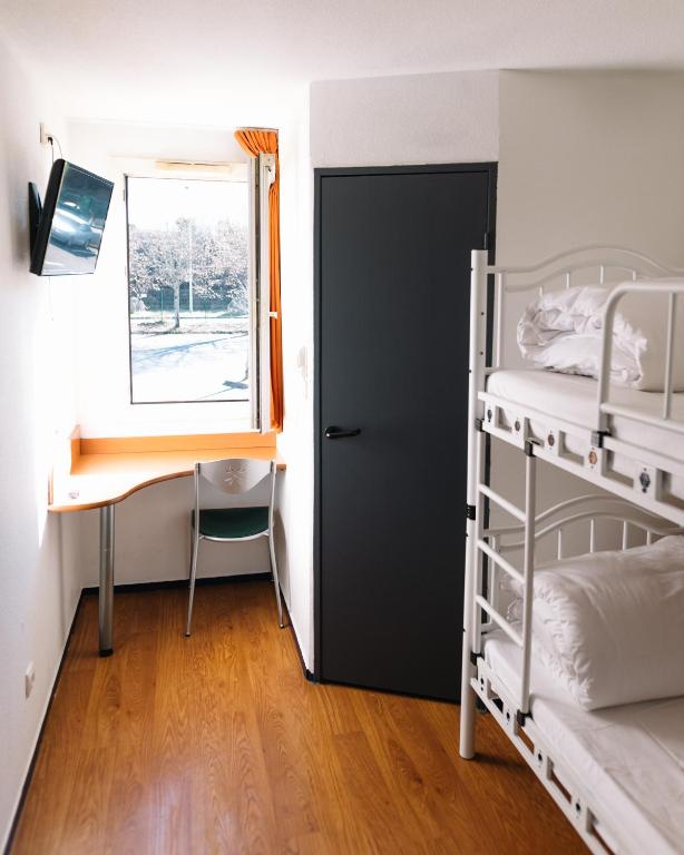 Postel nebo postele na pokoji v ubytování Welcomotel Limoges