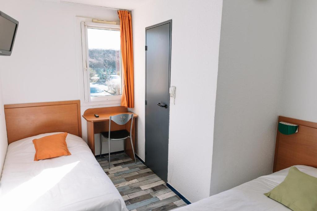 Postel nebo postele na pokoji v ubytování Welcomotel Limoges