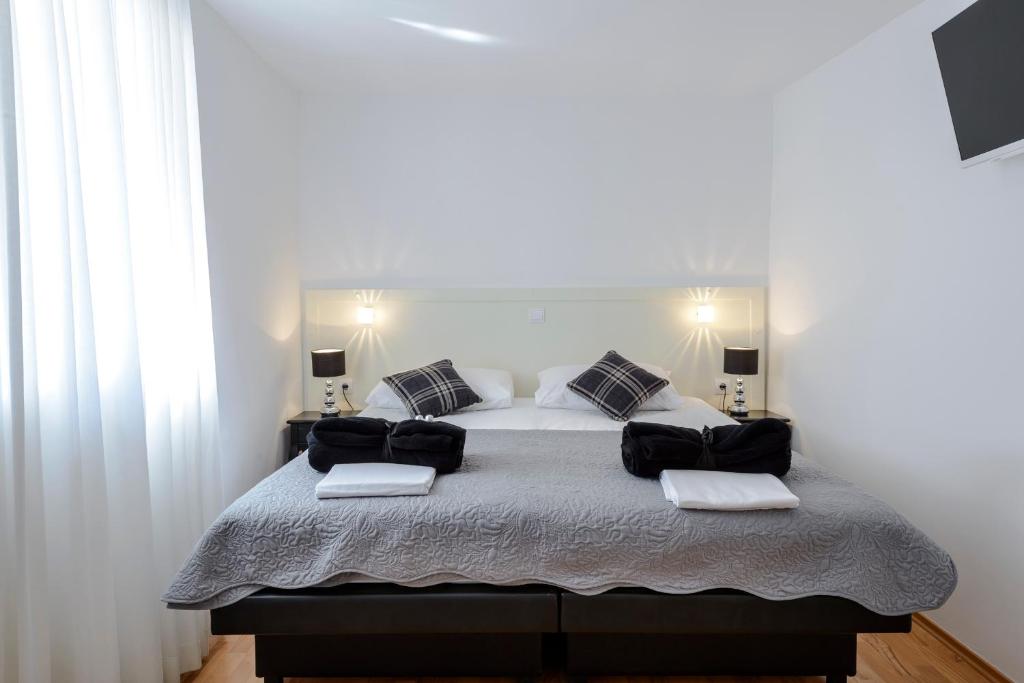 Posteľ alebo postele v izbe v ubytovaní Rooms Andro