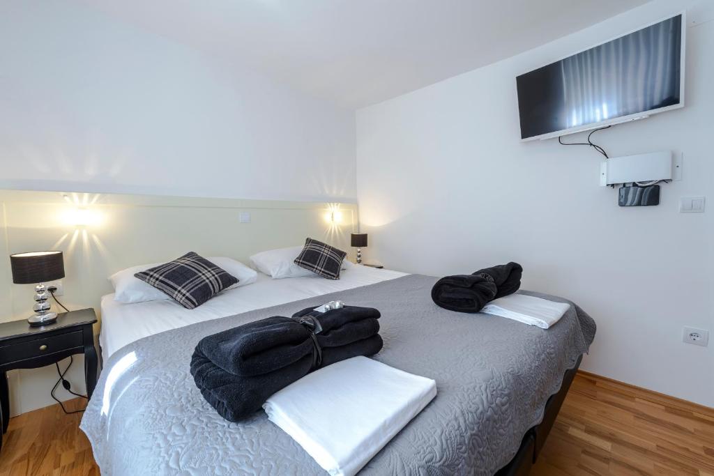 Posteľ alebo postele v izbe v ubytovaní Rooms Andro
