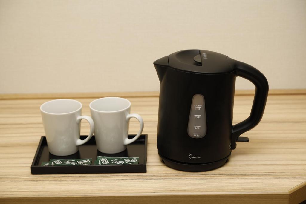 Příslušenství pro přípravu čaje a kávy v ubytování Dormy Inn Maebashi