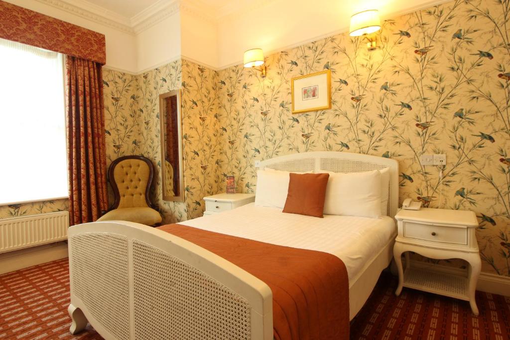 Postel nebo postele na pokoji v ubytování Castle Hotel