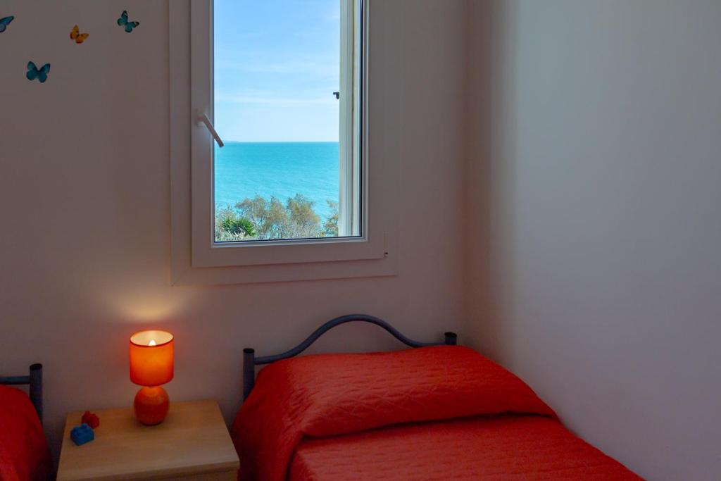 Postel nebo postele na pokoji v ubytování Lumia Case Vacanze