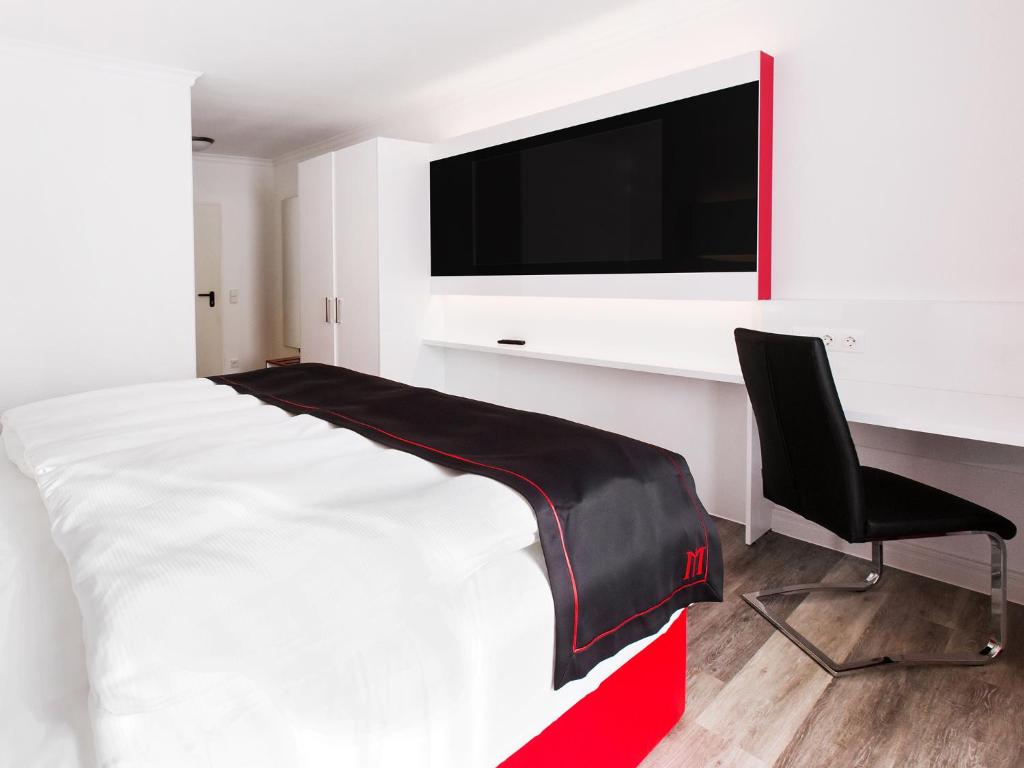 Postel nebo postele na pokoji v ubytování DORMERO Hotel München-Kirchheim Messe