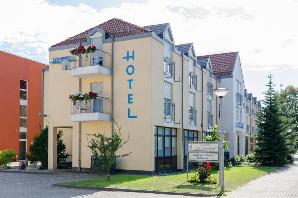 a building with the word hotel on it at Hotel Quellenhof in Salzgitter