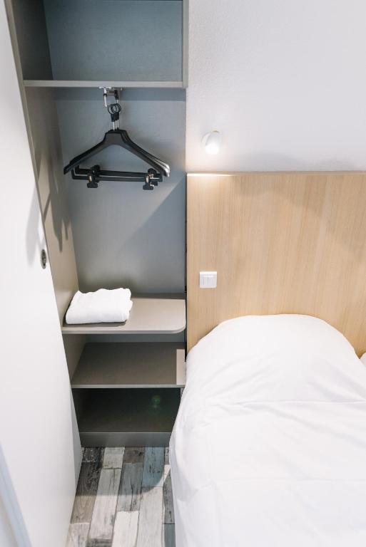 Postel nebo postele na pokoji v ubytování Welcomotel Limoges