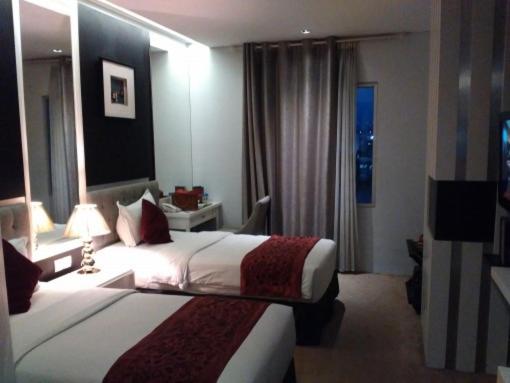 Postel nebo postele na pokoji v ubytování Gino Feruci Braga by KAGUM Hotels