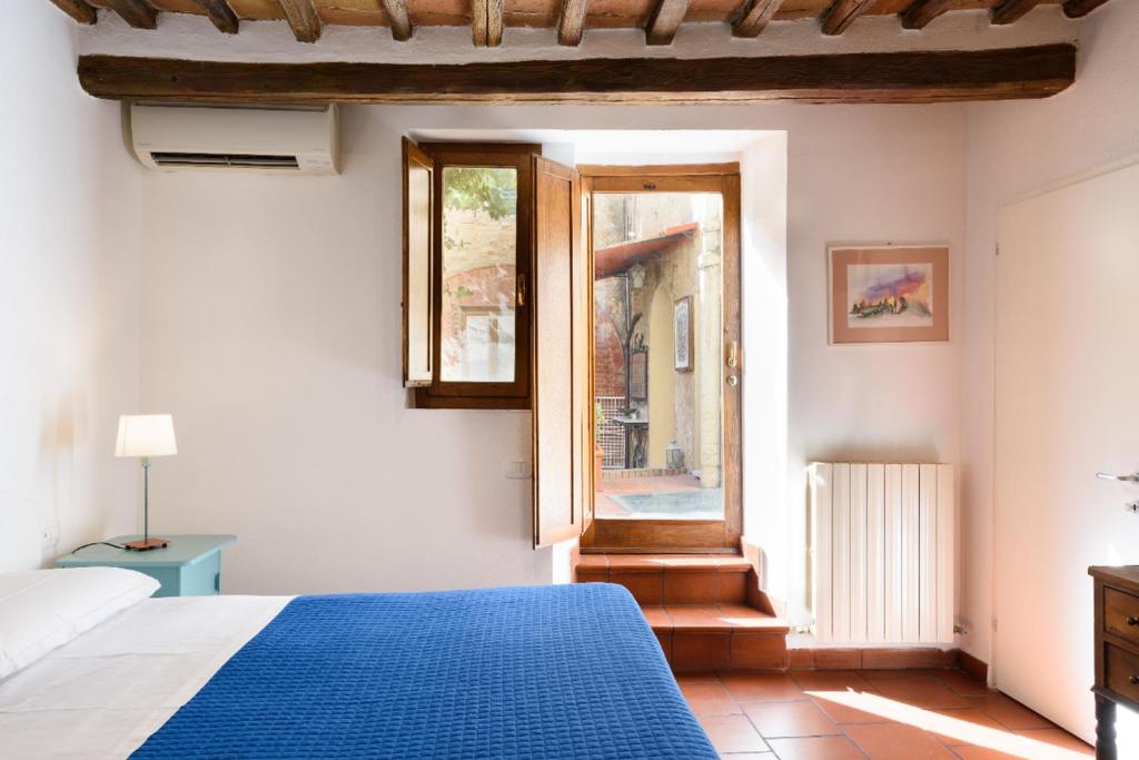 Postel nebo postele na pokoji v ubytování Piazza Paradiso Accommodation