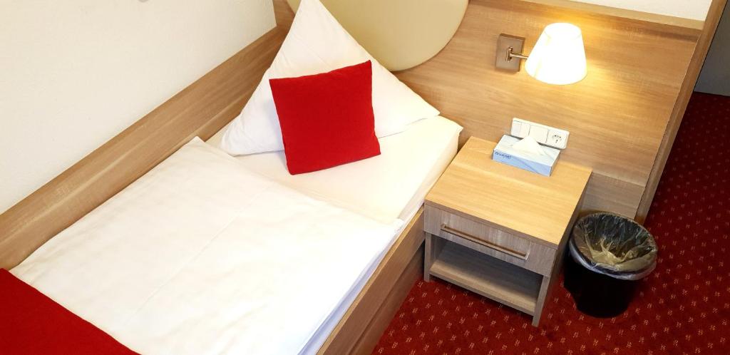 Postel nebo postele na pokoji v ubytování Aparthotel Wangener Landhaus