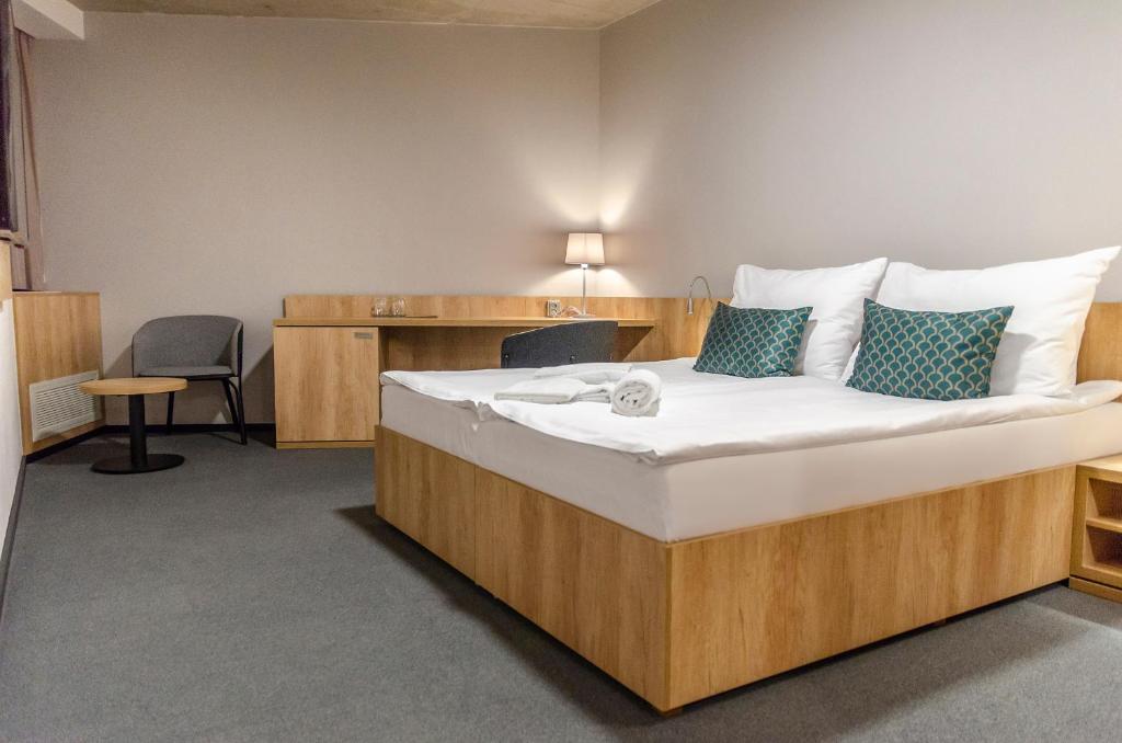 Postel nebo postele na pokoji v ubytování Hotel D1
