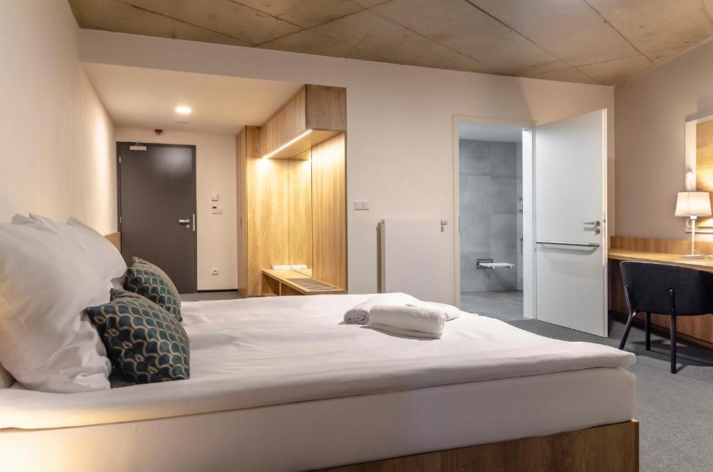 Postel nebo postele na pokoji v ubytování Hotel D1