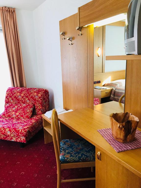 Postel nebo postele na pokoji v ubytování Hotel Santoni