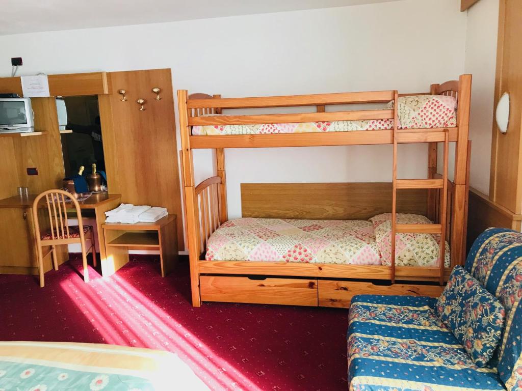 Postel nebo postele na pokoji v ubytování Hotel Santoni