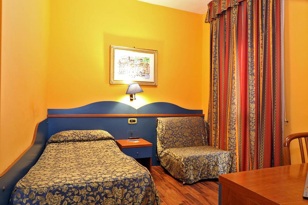 Postel nebo postele na pokoji v ubytování Hotel Al Castello