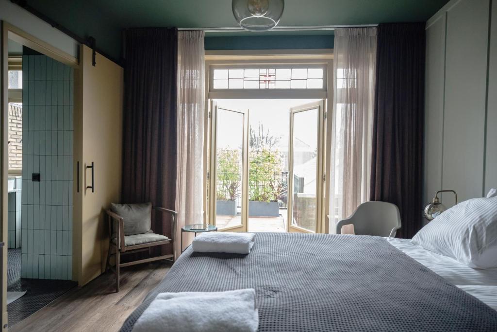 Postel nebo postele na pokoji v ubytování Seabreeze Suites - near Zandvoort aan Zee