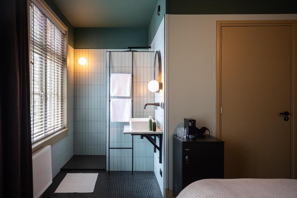 Postel nebo postele na pokoji v ubytování Seabreeze Suites - near Zandvoort aan Zee