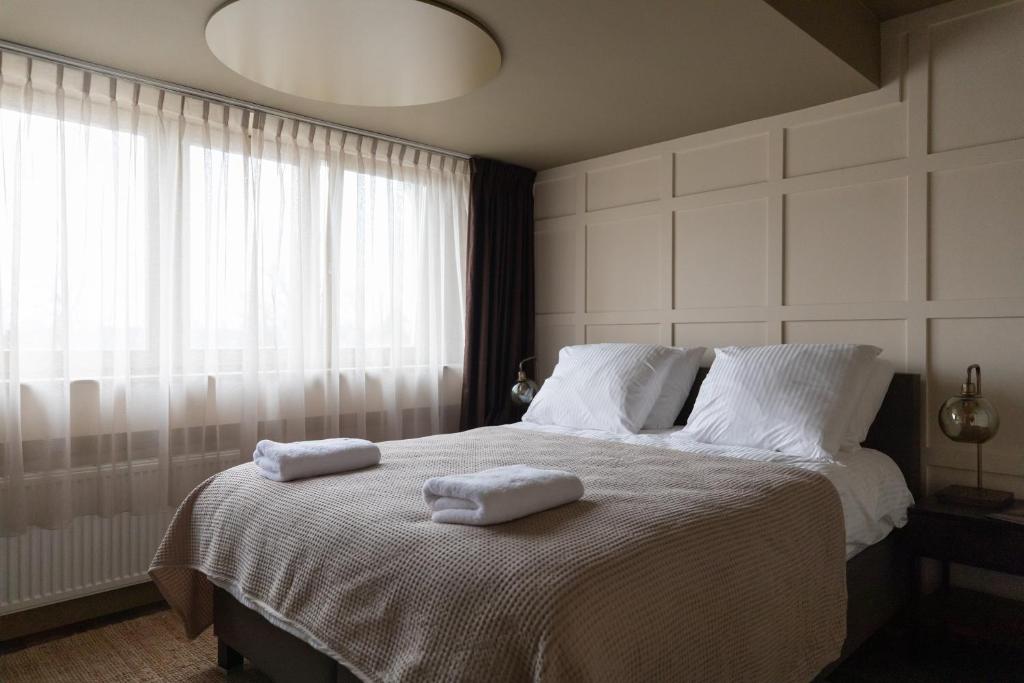 Postel nebo postele na pokoji v ubytování Seabreeze Suites - near Zandvoort aan Zee
