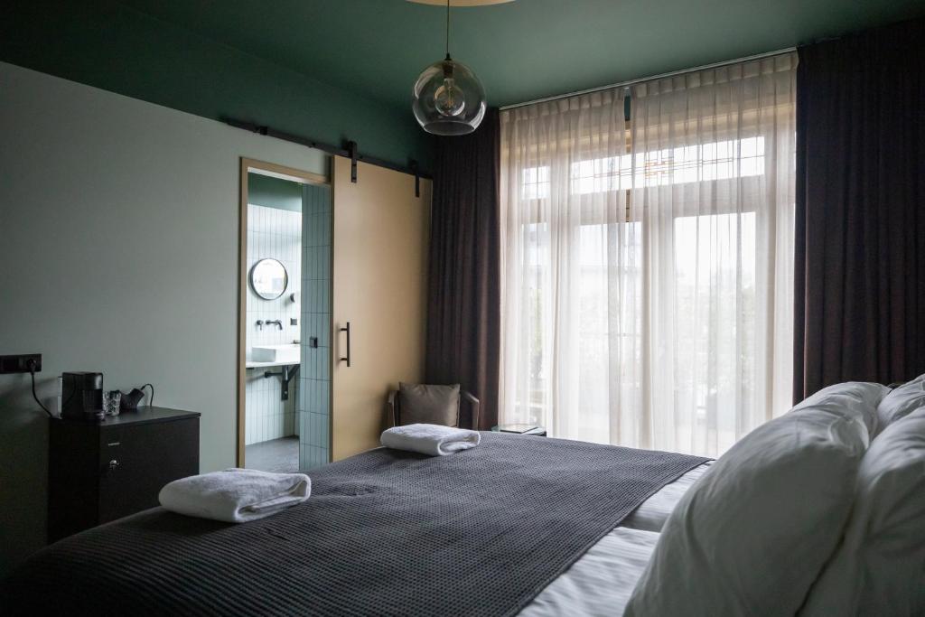Postel nebo postele na pokoji v ubytování Seabreeze Suites - near Zandvoort aan Zee