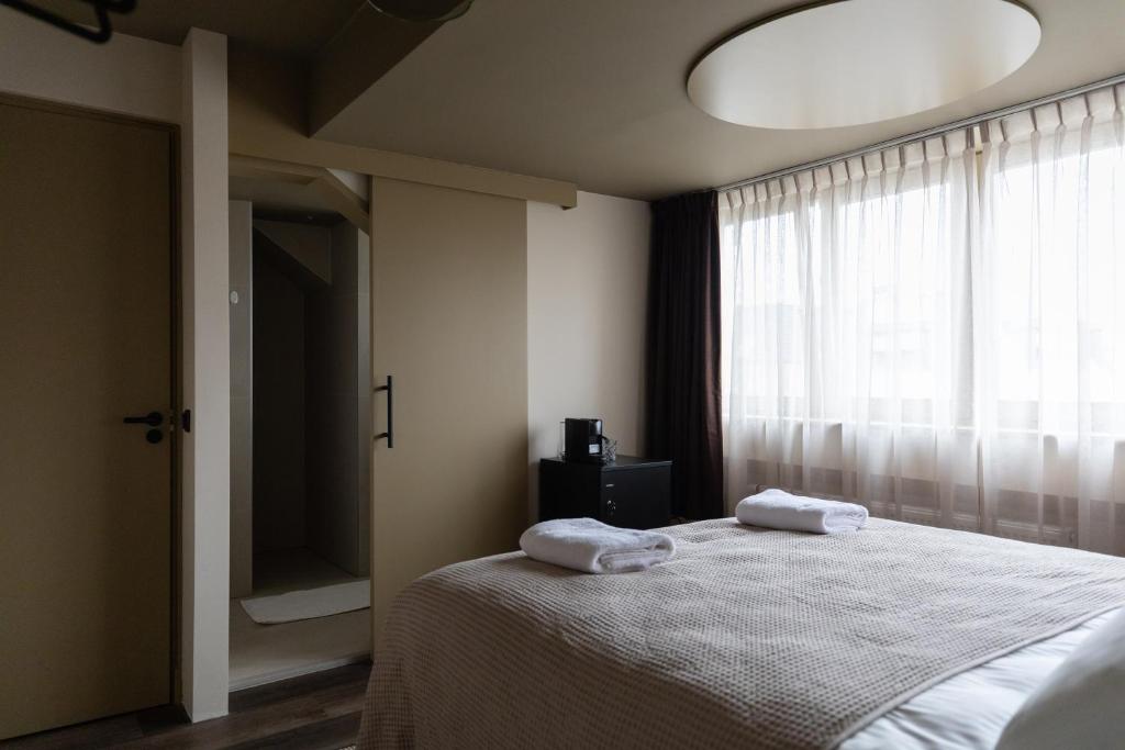 Postel nebo postele na pokoji v ubytování Seabreeze Suites - near Zandvoort aan Zee