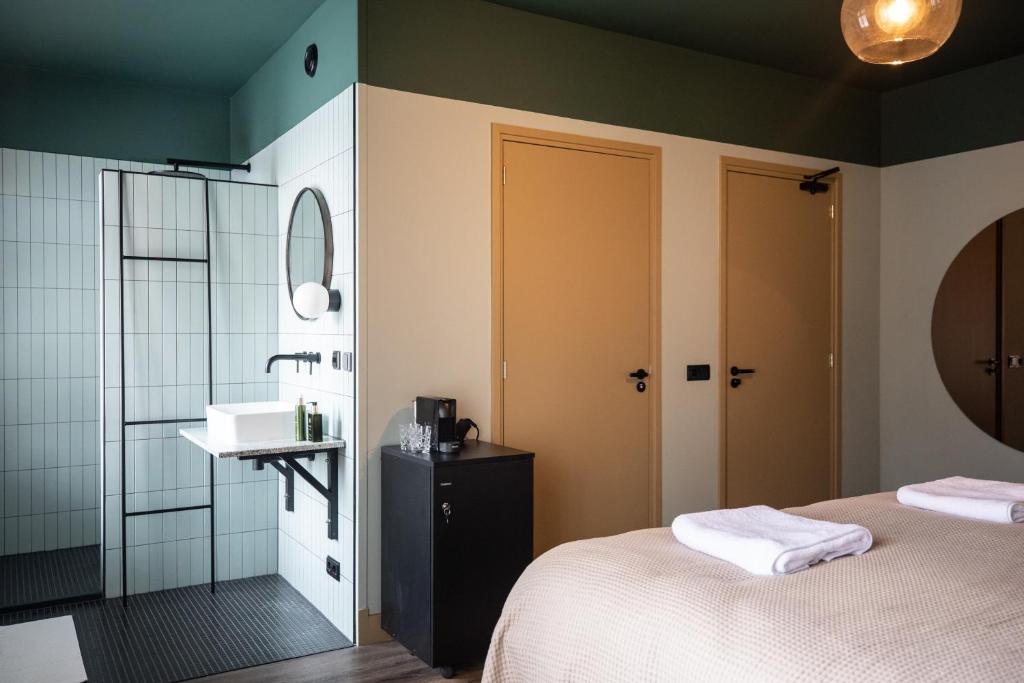 Postel nebo postele na pokoji v ubytování Seabreeze Suites - near Zandvoort aan Zee