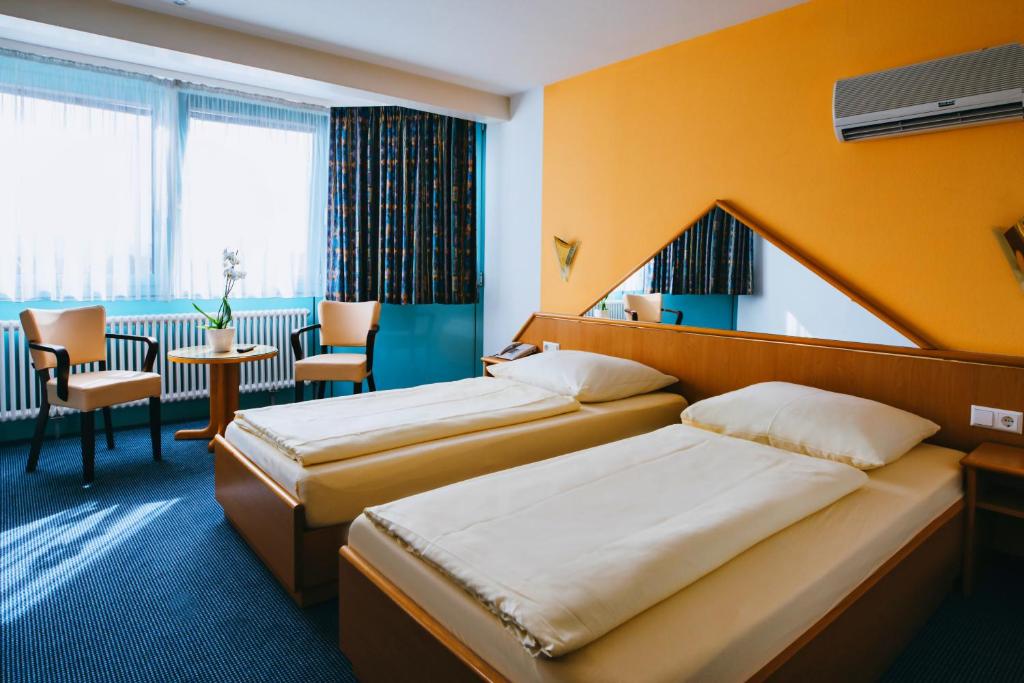 Postel nebo postele na pokoji v ubytování Hotel Central
