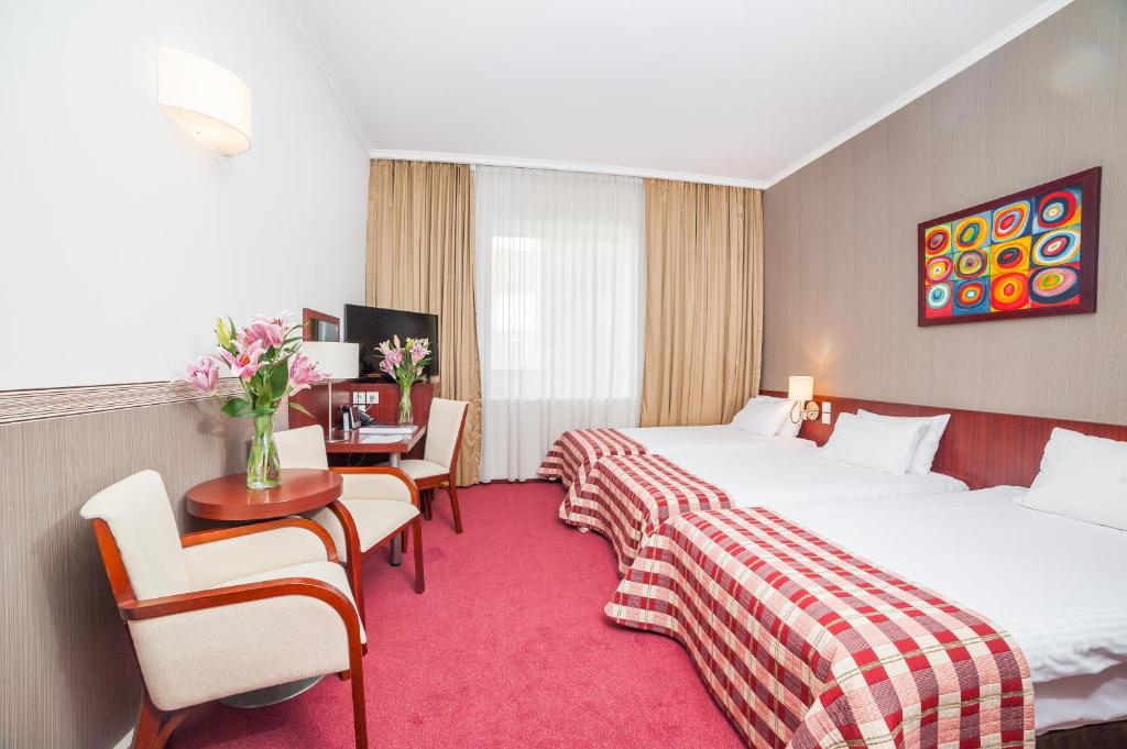Posteľ alebo postele v izbe v ubytovaní Premier Kraków Hotel