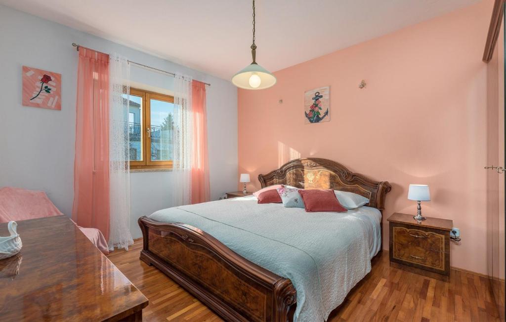 Postel nebo postele na pokoji v ubytování Apartmani Katalin
