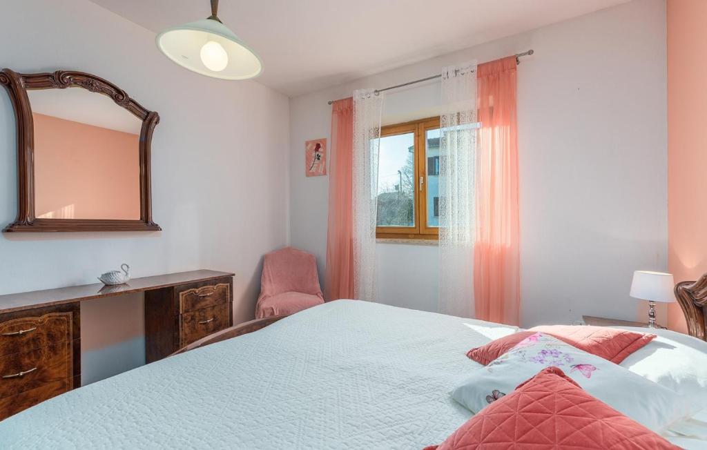 Postel nebo postele na pokoji v ubytování Apartmani Katalin