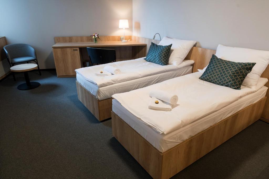 Postel nebo postele na pokoji v ubytování Hotel D1