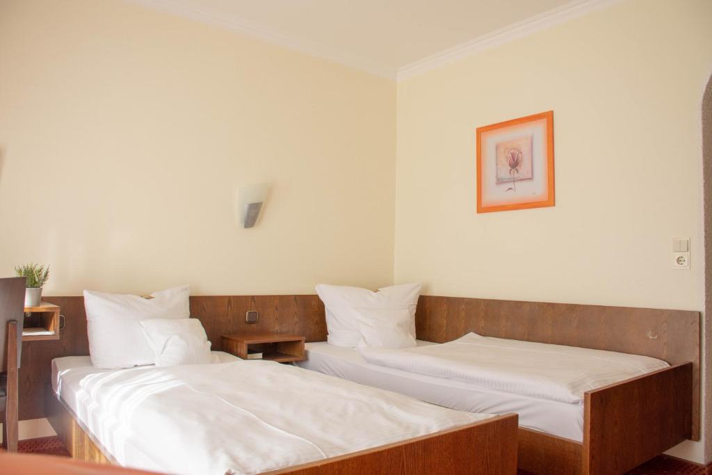 Postel nebo postele na pokoji v ubytování Hotel Restaurant Rothkopf
