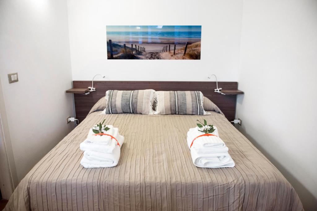 Posteľ alebo postele v izbe v ubytovaní Casa Vela Bianca Mondello Addaura