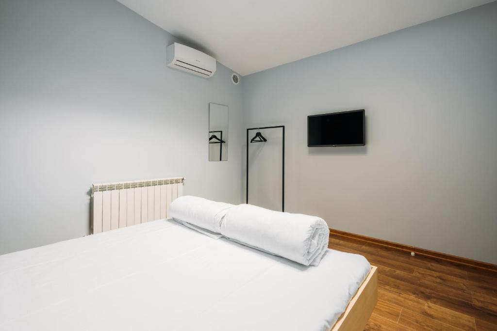 Postel nebo postele na pokoji v ubytování Yard Hostel & Coffee