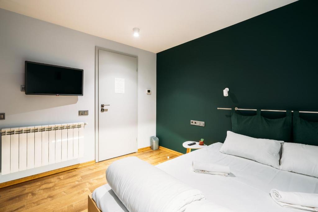 Postel nebo postele na pokoji v ubytování Yard Hostel & Coffee