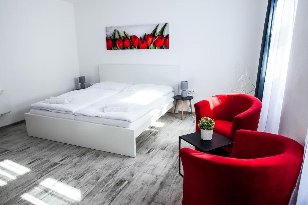 Postel nebo postele na pokoji v ubytování Rezidence Černý medvěd