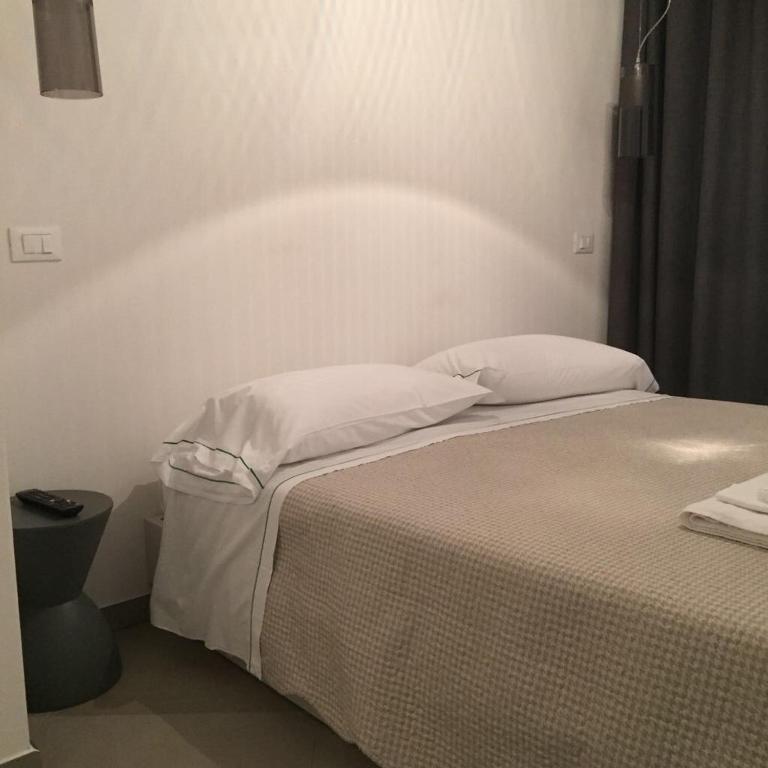 Postel nebo postele na pokoji v ubytování Camere Nicolina 2