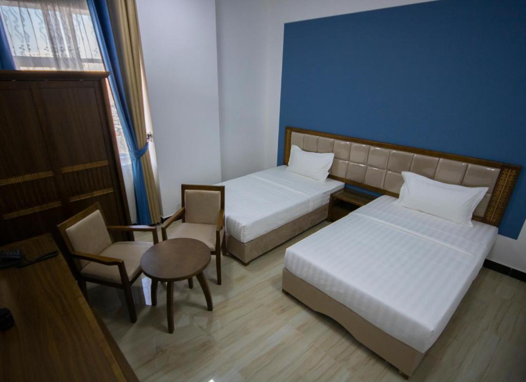 Postel nebo postele na pokoji v ubytování Home Station Hotel