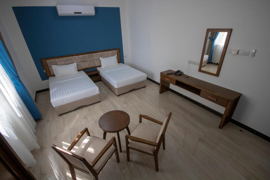 Postel nebo postele na pokoji v ubytování Home Station Hotel