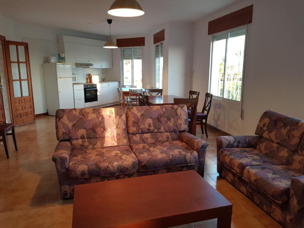 a living room with two couches and a table at Catalejo 5 Aguilas,Murcia in Águilas