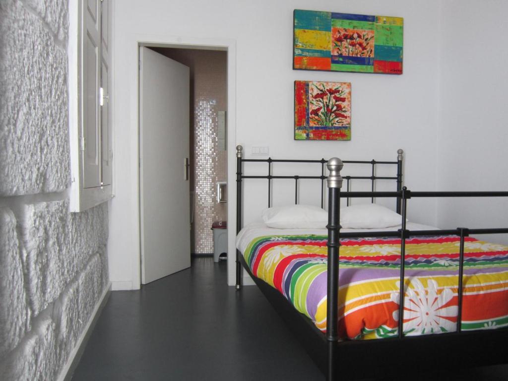 Postel nebo postele na pokoji v ubytování Hostel Prime Guimaraes