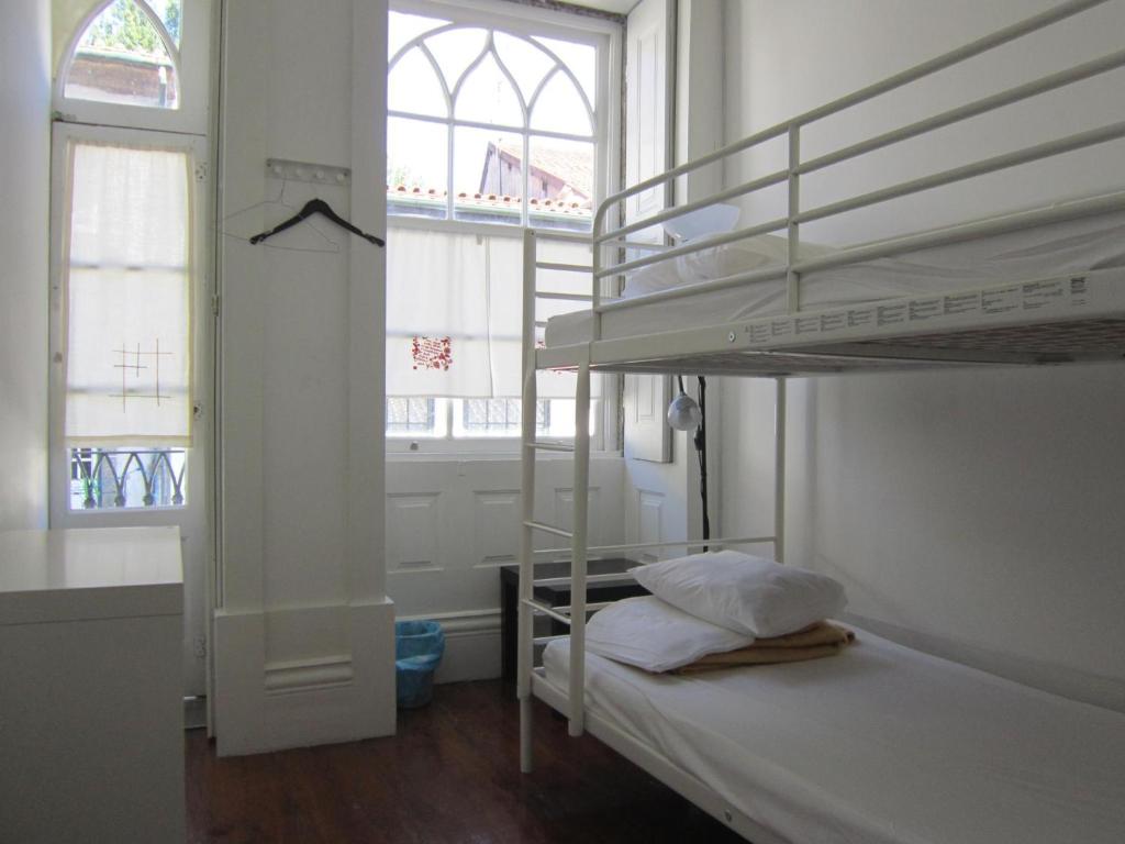 Postel nebo postele na pokoji v ubytování Hostel Prime Guimaraes