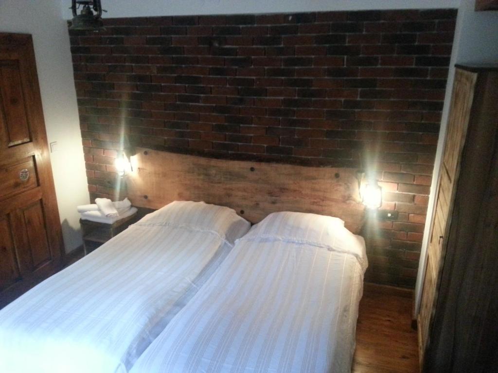 Postel nebo postele na pokoji v ubytování Amazon Petite Palace
