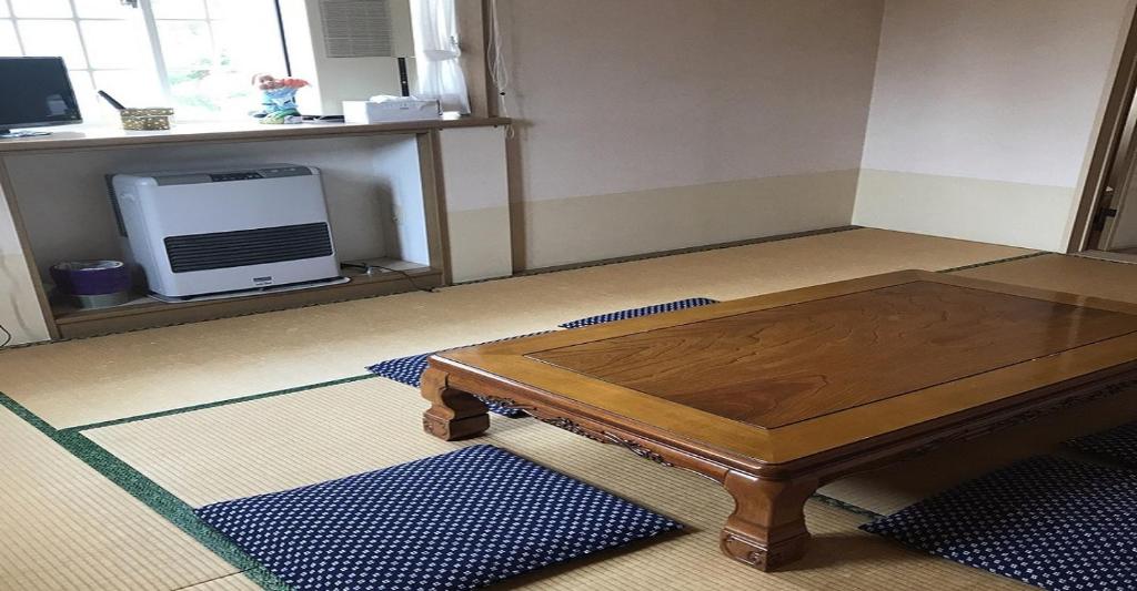 a coffee table sitting on the floor in a room at Myoko - Hotel / Vacation STAY 17055 in Myoko