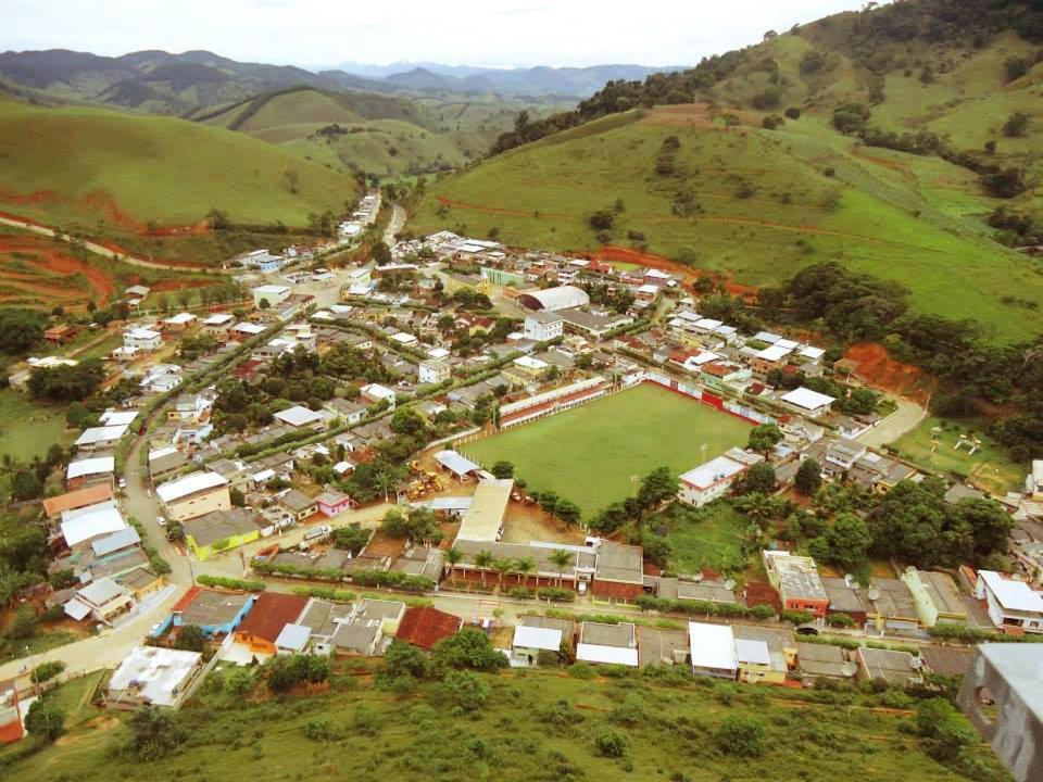 an aerial view of a village in the hills at Casinhas no Interior de MG in Antônio Prado