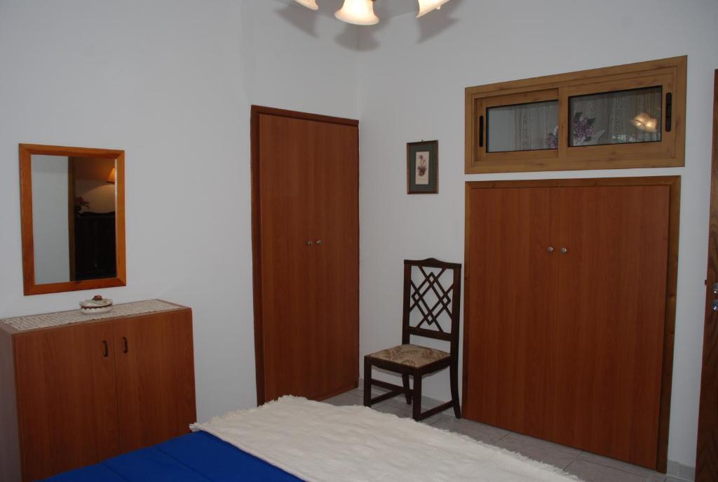 Postel nebo postele na pokoji v ubytování Kanarinis Apartments