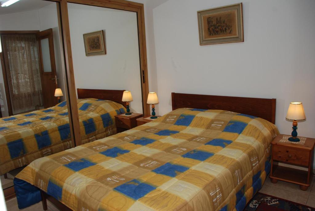 Postel nebo postele na pokoji v ubytování Kanarinis Apartments
