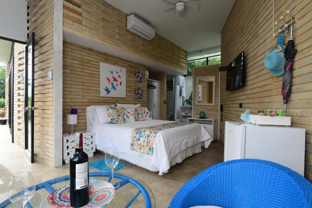 Postel nebo postele na pokoji v ubytování Hotel Casa Ambrosia