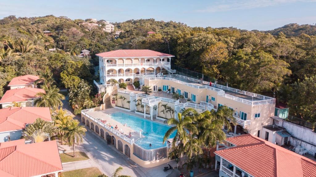 an aerial view of a mansion with a swimming pool at West End Dive Resort in West End