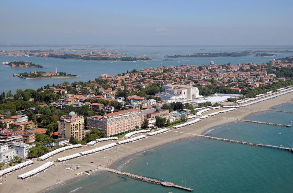an aerial view of a beach and a city at Hotel Excelsior Venice in Venice-Lido